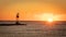 Sunrise over the Atlantic with a channel marker at the end of a jetty at Barnegat Inlet
