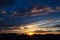 Sunrise over big city with amazing clouds