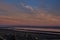 Sunrise over Bristol Bay from the dock at Ekuk Alaska at low tide.