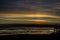 Sunrise over Bristol Bay from the dock at Ekuk Alaska at low tide.