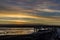 Sunrise over Bristol Bay from the dock at Ekuk Alaska at low tide.