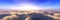 Sunrise over the clouds. Sunset over the clouds. The moon in the clouds. Panorama of clouds.