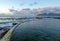 Sunrise over curving seawall at Dale Brook Tide Pool in Cape Town South Africa SA