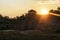 Sunrise over a deep flooded quarry