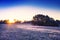 Sunrise over frosty meadow