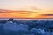 Sunrise over the ice of lake Baikal in winter, Eastern Siberia,