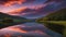 sunrise over the lake _A lake and a road at sunset with a stunning reflection. The image shows a calm and serene scene