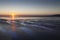 Sunrise over low tide on Swansea Bay