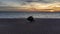 Sunrise over Maggi Hambling`s sculpture of the Scallop on the shingle beach in Aldeburgh