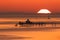 Sunrise over the Menai Strait showing Bangor Pier and the mountains of Snowdonia