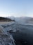 Sunrise over a misty hot creek in the winter day