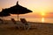 Sunrise over the parasol on the beach, Tunisia