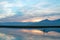 Sunrise over partially submerged dead tree branches in Lake Isabella in the Sierra Nevada mountains in central California USA