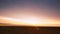 Sunrise over a Plowed Field. Time Lapse UHD