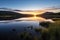 sunrise over a pristine lake in a wilderness reserve