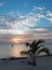 Sunrise over Puerto Juarez Bay, Beach, and fishing boat in Cancun Mexico