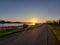 Sunrise over river Hollandsche IJssel near the windmill Windlust in Nieuwerkerk