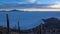 Sunrise over the Salar de Uyuni and Tunupa Volcano from Isla Incahuasi. Uyuni, Bolivia