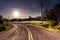 Sunrise over scenic old winding road with yellow lanes