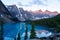 Sunrise Over a Serene Blue Lake in the Rocky Mountains of Alberta, Canada