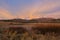 Sunrise over snowcapped mountains