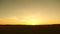 Sunrise over the steppe in the summer. Sunset in the spring field. the sun sets over the horizon.