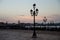 Sunrise over street lamps on San Marco square
