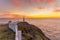 Sunrise over a white lighthouse at Cape Spear National Historic Site, St Johns Newfoundland.