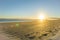 Sunrise over wide flat sandy beach at Ohope Whakatane