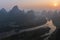 Sunrise over Xingping karsts hills in Xianggong hill and Li river at sunset near Yangshuo in Guanxi province, China