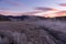 Sunrise paints the Sierra Sky pastel colors as mist rises