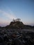 Sunrise panorama of atlantic coast chapel on rock cliff Ermida da Virxe do Porto Meiras Valdovino A Coruna Galicia Spain