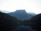 Sunrise panorama mirror reflection view of alpine forest mountain lake Piburger See Oetztal Alps Tyrol Austria Europe