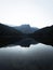 Sunrise panorama mirror reflection view of alpine forest mountain lake Piburger See Oetztal Alps Tyrol Austria Europe