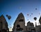 Sunrise panoramic view to Goreme city and flying balloons, Cappadocia, Turkey