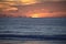 The sunrise peaks over the ocean horizon off the Amelia Island coastline