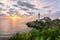 Sunrise at Portland Head Lighthouse with flowers in the foreground