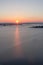 Sunrise. Rays of the morning sun. Dnieper. Rzhishchev. Ukraine. Vertical shot.