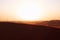 Sunrise on the red sand dunes of the Arabian desert in Riyadh, Saudi Arabia. Bright future, new beginnings, symbol of hope.