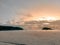 Sunrise reflections on the beach sand. Textured and watery sandy beach