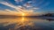 Sunrise reflections at low tide at Tenby in Wales