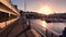 Sunrise reveal at Torquay Harbour metal fence by boats, English Riviera, England