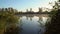 Sunrise on the riverbank. Landscape with reeds on first plan and smoke on the water