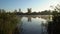 Sunrise on the riverbank. Landscape with reeds on first plan and smoke on the water