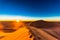 Sunrise in the Sahara desert next to M`hamid in Morocco