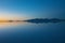 Sunrise on Salar de Uyuni in Bolivia covered with water, salt flat desert and sky reflections