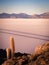 Sunrise on the salt flat of Uyuni. Salar de Uyuni in Bolivia with a car crossing it