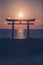 Sunrise and sea at Japanese shinto gate