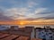 Sunrise on the sea , roofs.