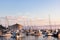 Sunrise seascape in Avalon harbor looking toward the Casino with sailboats, fishing boats and yachts moored in calm bay